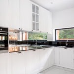 Luxury,Kitchen,Interior,,With,Black,Countertops,And,White,Cupboards